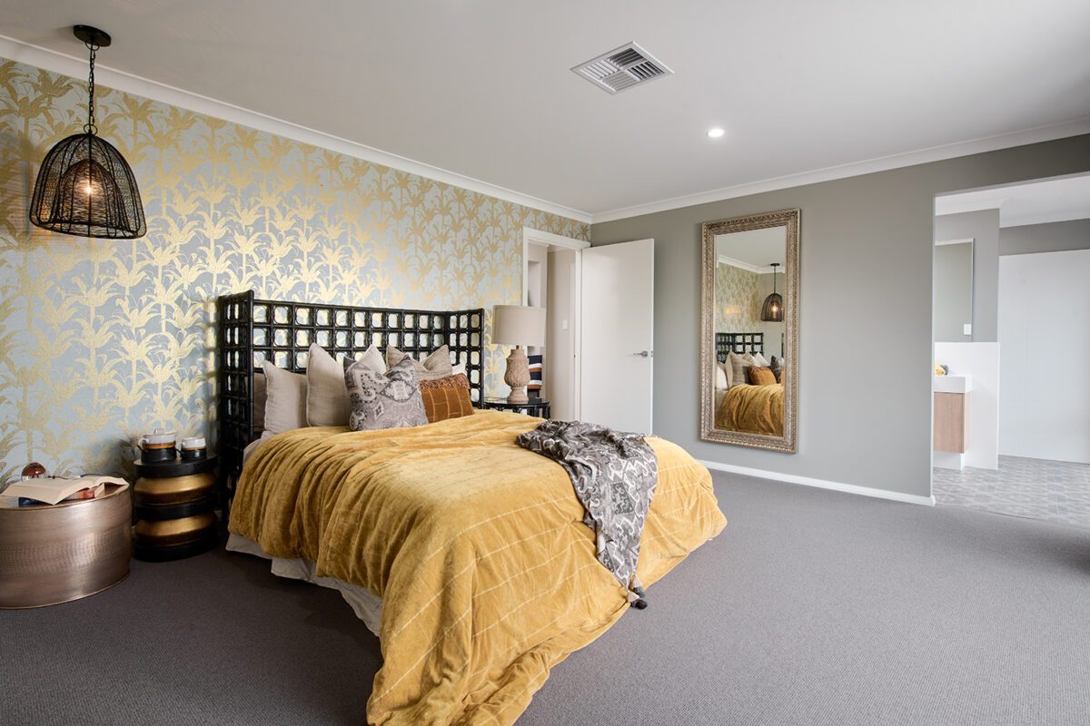 Master bedroom with an ensuite and large walk-in closet in The Milpara - WA Country Builders