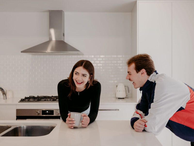 Dalyellup client home lifestyle photoshoot with Skylar and Dylan leaning on kitchen island benchtop